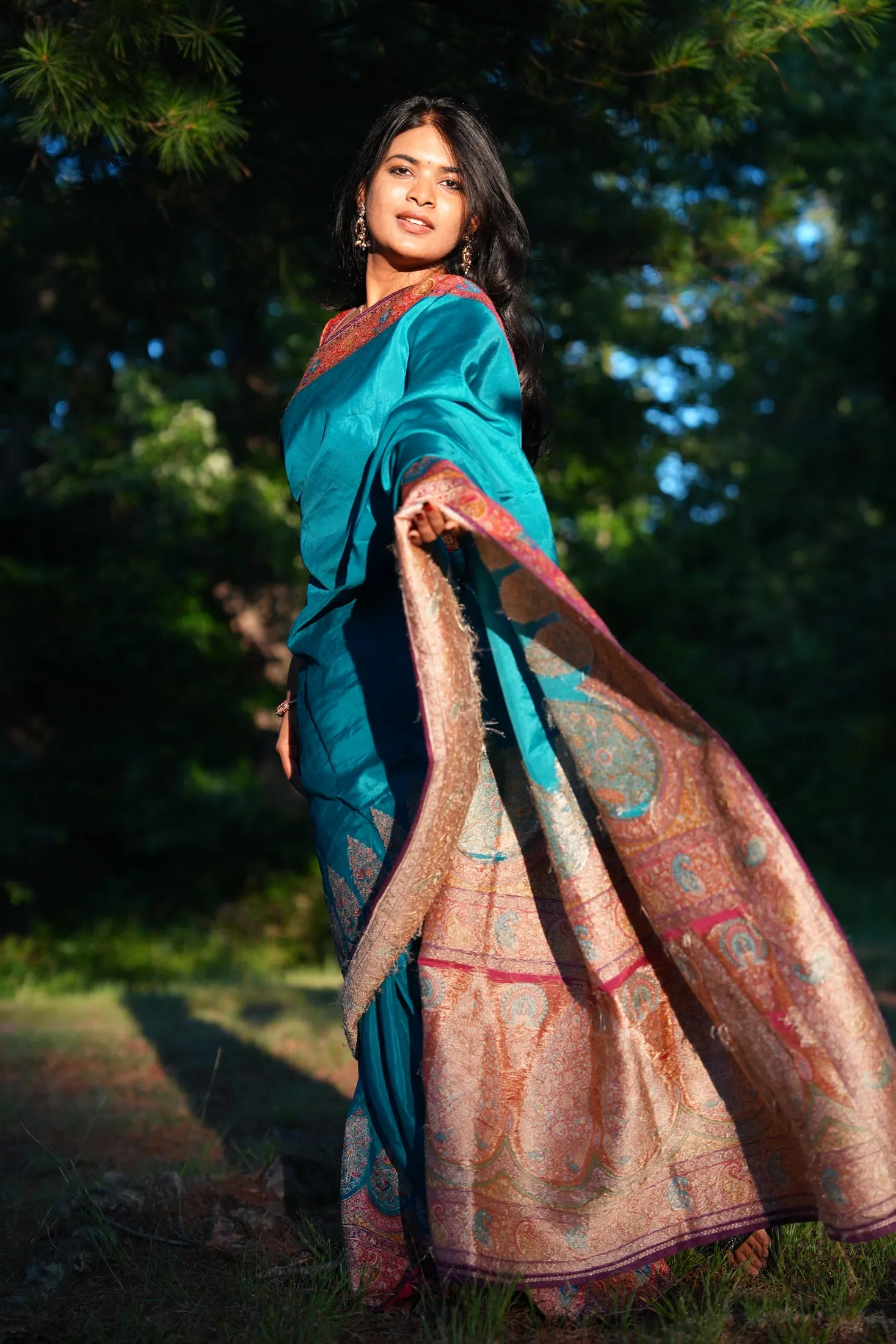Editorial golden-hour portrait, backlit fabric in motion